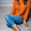 craiyon_135209_Full_body_shot_of_a_stunningly_beautiful_woman_sitting_on_the_floor__Brown_hair__oran.png
