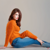 craiyon_135213_Full_body_shot_of_a_stunningly_beautiful_woman_sitting_on_the_floor__Brown_hair__oran.png