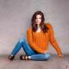 craiyon_135215_Full_body_shot_of_a_stunningly_beautiful_woman_sitting_on_the_floor__Brown_hair__oran.png