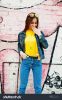 stock-photo-beautiful-teenage-girl-wear-yellow-t-shirt-and-jeans-near-graffiti-wall-617115314.jpg