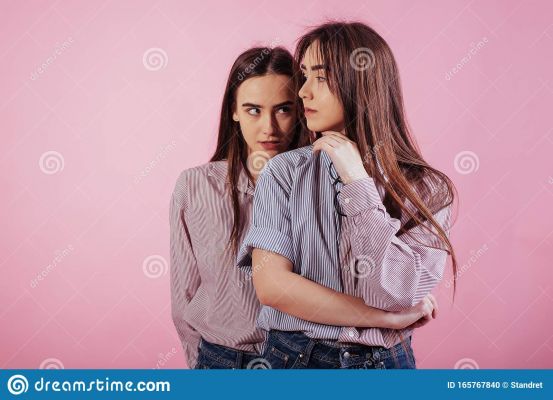 same-clothes-different-character-two-sisters-twins-standing-posing-studio-white-background-same-clothes-165767840.jpg