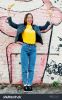 stock-photo-beautiful-fun-teenage-girl-showing-tongue-with-bananas-at-hands-wear-yellow-t-shirt-jeans-near-617363540.jpg