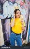 stock-photo-beautiful-fun-teenage-girl-with-banana-at-hand-wear-yellow-t-shirt-jeans-and-crown-on-stick-near-617116508.jpg