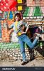stock-photo-beautiful-teenage-walking-with-heart-balloon-wear-jeans-near-graffiti-wall-617363522.jpg