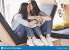two-twin-girls-sit-tight-armchair-them-recreation-area-sisters-posing-having-fun-spend-time-join-132224604.jpg